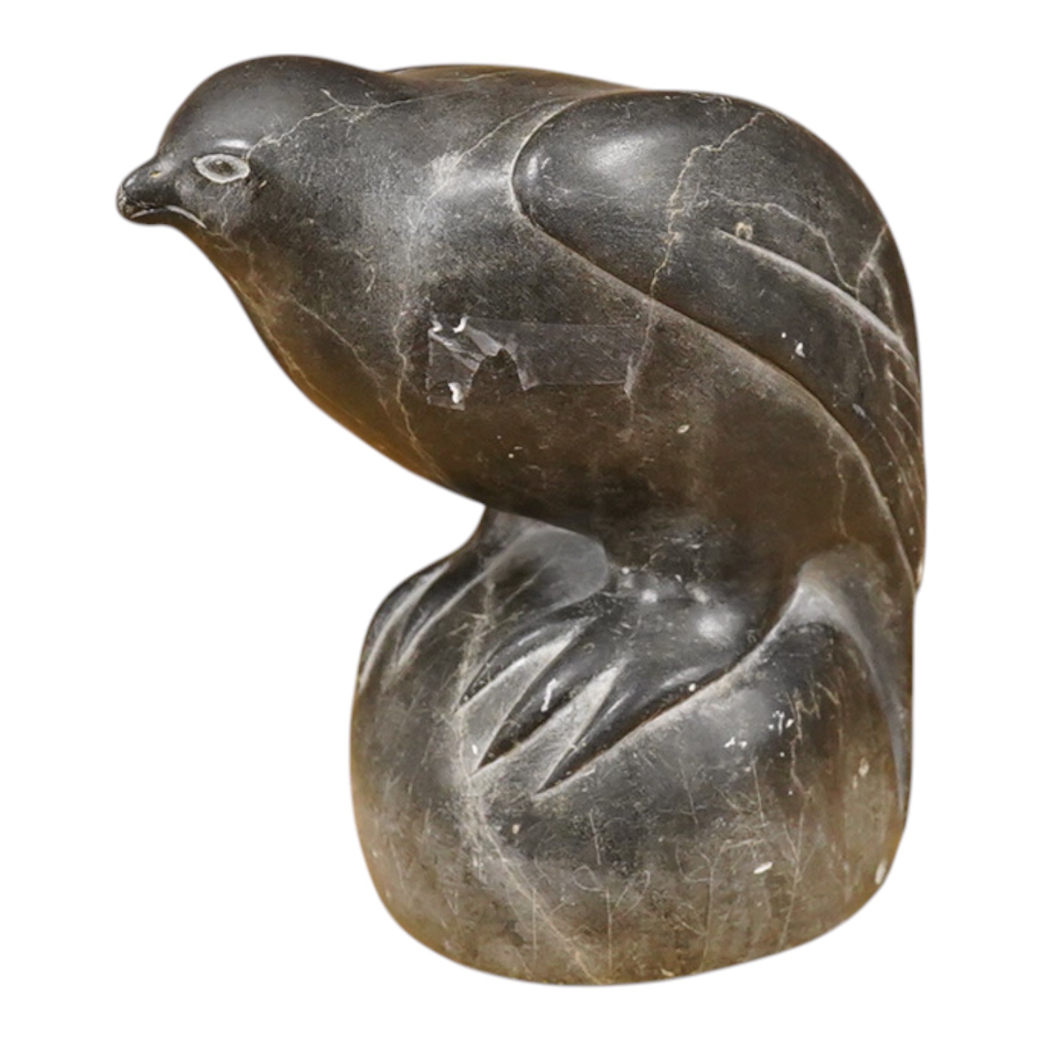 An Inuit stone carving of a falcon by Isapik, 18cm high